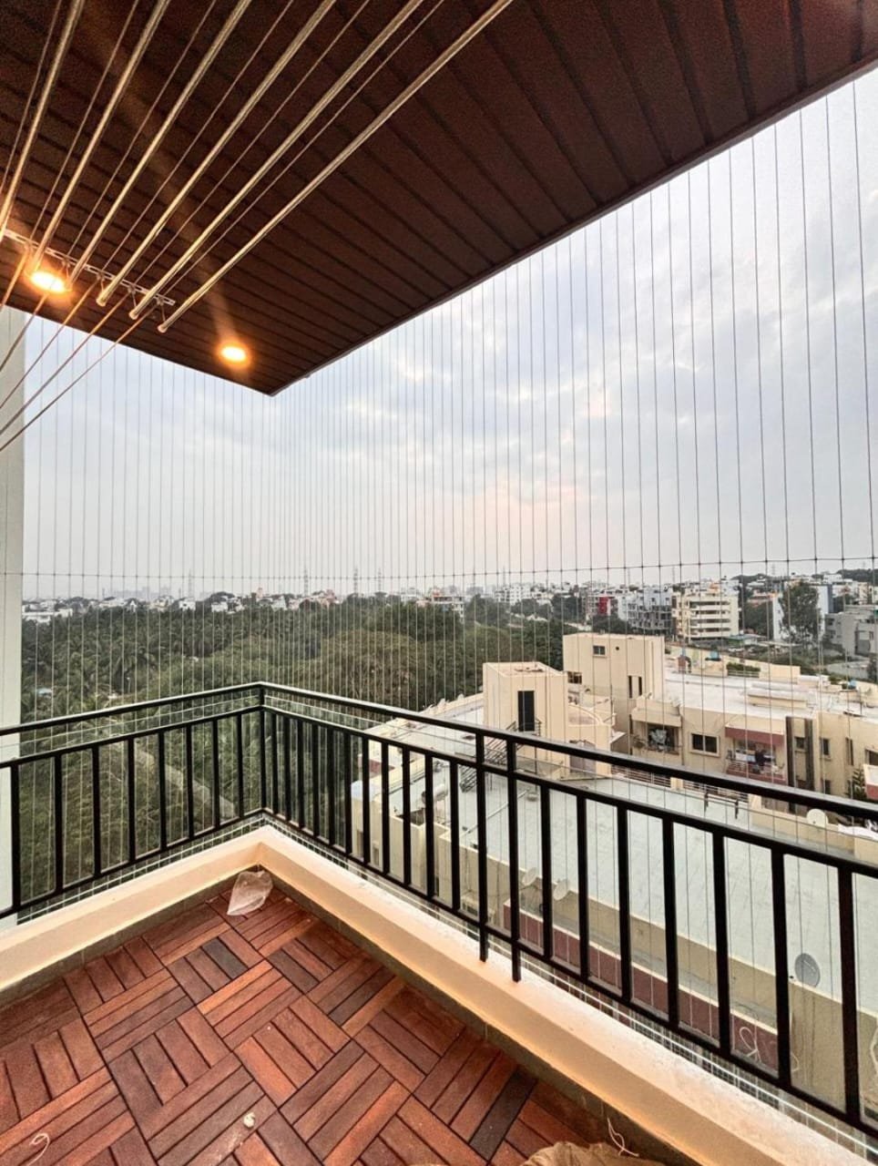 Invisible grill installation on residential balcony